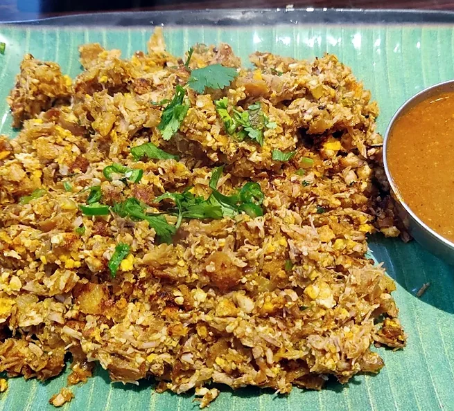 Veg kothu paratha: chopped paratha stir-fried with onion, green chilli and coriander, with salna on the side